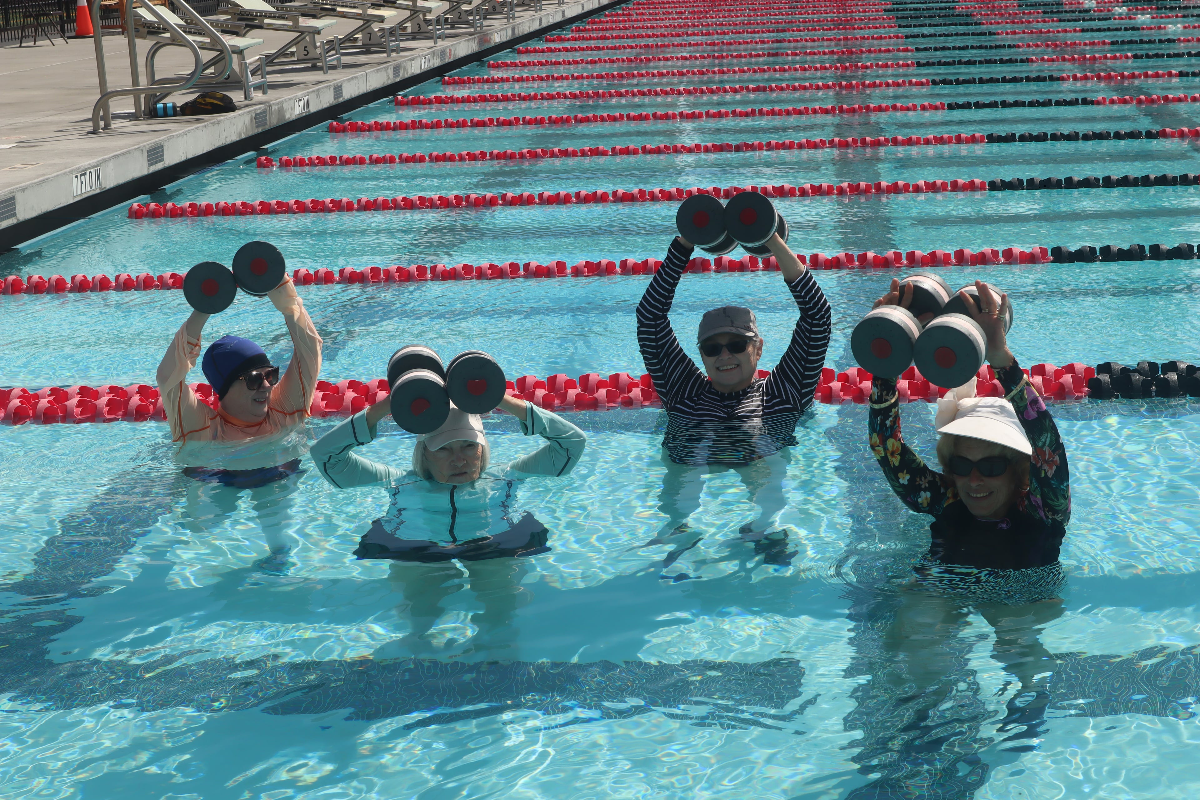 Aqua aerobics class in outdoor pool